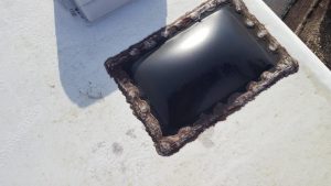 Picture of a leaking RV roof skylight seal before repairs