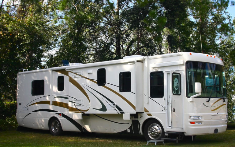 Motorhome in the woods. Cocnept image of motorized RV services.