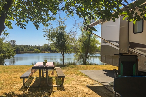 Rv camping next to the lake on a sunny summer day